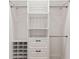Organized closet with built-in shelving, drawers, and hanging rods at 205 Mary Ave, New Smyrna Beach, FL 32168
