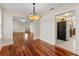 Open dining area with hardwood floors and a decorative chandelier at 205 Mary Ave, New Smyrna Beach, FL 32168