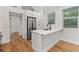 Modern kitchen with quartz counters, stainless appliances, and an island at 205 Mary Ave, New Smyrna Beach, FL 32168