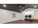 Laundry area with wood ceiling, featuring a washer and dryer set and natural light from a window at 205 Mary Ave, New Smyrna Beach, FL 32168