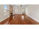 Cozy living room featuring hardwood floors and a stone fireplace at 205 Mary Ave, New Smyrna Beach, FL 32168
