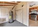 Mud room with water heater, storage, and access to the kitchen at 205 Mary Ave, New Smyrna Beach, FL 32168