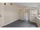 Empty room featuring neutral paint, wood-look floors, sconce lighting, and an open doorway at 205 Mary Ave, New Smyrna Beach, FL 32168