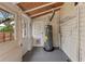 Utility room featuring a water heater, storage, and access to the backyard at 205 Mary Ave, New Smyrna Beach, FL 32168