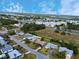 Aerial view of a quiet residential neighborhood with water views and easy access to nearby amenities at 209 Oak Branch Drive, Edgewater, FL 32141
