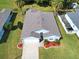 Aerial view of a well-manicured home with a pristine lawn at 209 Oak Branch Drive, Edgewater, FL 32141
