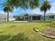 Expansive backyard with mature trees and manicured lawn at 209 Oak Branch Drive, Edgewater, FL 32141