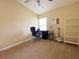 Bedroom with a vaulted ceiling, ceiling fan, carpet, and large window at 209 Oak Branch Drive, Edgewater, FL 32141