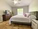 Serene bedroom with a plush bed, natural light, sleek furnishings, and ample space for relaxation and personalization at 209 Oak Branch Drive, Edgewater, FL 32141