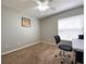 Neutral bedroom with a ceiling fan, window, and carpeted floor at 209 Oak Branch Drive, Edgewater, FL 32141
