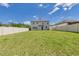Spacious backyard featuring a large green lawn, perfect for outdoor activities and entertaining at 2090 Prairie Sage Ln, Longwood, FL 32750