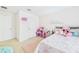 Charming bedroom with pink accents, plushes, and fun decor, providing a playful and inviting atmosphere at 2090 Prairie Sage Ln, Longwood, FL 32750