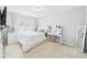 Bright bedroom with a make up vanity, a full length mirror, carpeted floors, and a large window at 2090 Prairie Sage Ln, Longwood, FL 32750