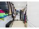 Walk-in closet featuring shelving and clothing racks for organized storage solutions at 2090 Prairie Sage Ln, Longwood, FL 32750