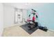 Bright exercise room with home gym equipment, perfect for staying active and healthy in the comfort of home at 2090 Prairie Sage Ln, Longwood, FL 32750