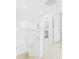 Bright hallway leading to several rooms, offering seamless connectivity and ample natural light at 2090 Prairie Sage Ln, Longwood, FL 32750