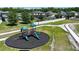 Community playground featuring green slides, swing set, with surrounding grassy areas and walking path at 2090 Prairie Sage Ln, Longwood, FL 32750