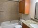 Bathroom with tile walls, vanity with granite countertop, and shower-tub combination at 2200 S Palmetto Ave # C040, Daytona Beach, FL 32119