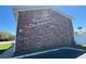 Colonial Townhouses Condominiums I sign on the corner of a brick building with adjacent green space at 2200 S Palmetto Ave # C040, Daytona Beach, FL 32119