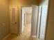 Bright hallway featuring wood floors, closet and doorway leading to bedrooms at 2200 S Palmetto Ave # C040, Daytona Beach, FL 32119