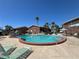 Inviting community pool surrounded by lounge chairs and lush landscaping with nearby townhouses at 2200 S Palmetto Ave # C040, Daytona Beach, FL 32119