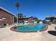 Community pool offering lounge chairs, shade and relaxation near the townhouses at 2200 S Palmetto Ave # C040, Daytona Beach, FL 32119