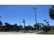 Community tennis courts surrounded by greenery and bathed in natural light at 2200 S Palmetto Ave # C040, Daytona Beach, FL 32119