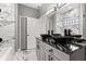 Modern bathroom features dual black vessel sinks, marble tile, and gray vanity at 226 N Frederick Ave, Daytona Beach, FL 32114
