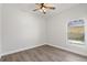 Bright bedroom features natural light from a window and stylish wood-look flooring at 226 N Frederick Ave, Daytona Beach, FL 32114