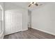 Spacious bedroom features a closet, a ceiling fan, and wood-look flooring at 226 N Frederick Ave, Daytona Beach, FL 32114