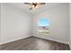 Bedroom has a large window, wood-look flooring and neutral walls at 226 N Frederick Ave, Daytona Beach, FL 32114