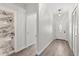 Inviting foyer with wood-look floors leading to a modern bathroom with marble and a shower at 226 N Frederick Ave, Daytona Beach, FL 32114