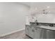 Modern kitchen with granite counters, stainless appliances, and mosaic tile backsplash at 226 N Frederick Ave, Daytona Beach, FL 32114