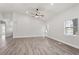 Large living room with high ceiling, abundant natural light, and wood-look flooring at 226 N Frederick Ave, Daytona Beach, FL 32114