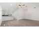 Open concept living area with wood-look flooring, high ceilings, and modern lighting at 226 N Frederick Ave, Daytona Beach, FL 32114