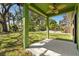 Covered porch with ceiling fan, overlooking a spacious yard at 226 N Frederick Ave, Daytona Beach, FL 32114