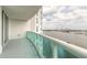 Wide balcony with sliding glass doors and views of the bridge, river, and cityscape at 231 Riverside Dr # 1003-1, Daytona Beach, FL 32117