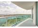 Balcony with glass railings overlooking city skyline, river and blue skies at 231 Riverside Dr # 1003-1, Daytona Beach, FL 32117