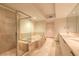 Elegant bathroom with glass shower, soaking tub, dual sinks and marble countertops at 231 Riverside Dr # 1003-1, Daytona Beach, FL 32117