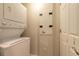 Convenient laundry area with stacked washer and dryer units at 231 Riverside Dr # 1003-1, Daytona Beach, FL 32117