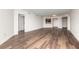 Spacious living area with hardwood floors, recessed lighting, and access to other rooms at 231 Riverside Dr # 1003-1, Daytona Beach, FL 32117
