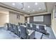 Private movie theater room with comfortable seating and a large projection screen at 231 Riverside Dr # 1003-1, Daytona Beach, FL 32117