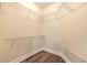 Spacious walk-in closet with wire shelving and wood-look floors offers ample storage space at 231 Riverside Dr # 1003-1, Daytona Beach, FL 32117
