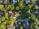 Aerial shot capturing this home in its neighborhood with its trees and lawns at 232 Westchester Dr, Deland, FL 32724