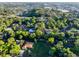 A high-angle view of the property nestled within a verdant neighborhood at 232 Westchester Dr, Deland, FL 32724