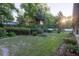 Backyard showing mature trees and landscaping creating a private and serene outdoor space at 232 Westchester Dr, Deland, FL 32724