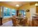 Dining area with a view of the backyard and a breakfast bar at 232 Westchester Dr, Deland, FL 32724