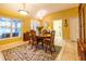 Dining room featuring a wooden table with chairs, natural light, and neutral tile flooring at 232 Westchester Dr, Deland, FL 32724