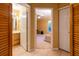 Hallway with access to a bathroom, closet, and a bedroom, with neutral colored walls at 232 Westchester Dr, Deland, FL 32724