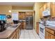 Functional kitchen featuring wooden cabinets, neutral countertops, and stainless steel appliances at 232 Westchester Dr, Deland, FL 32724